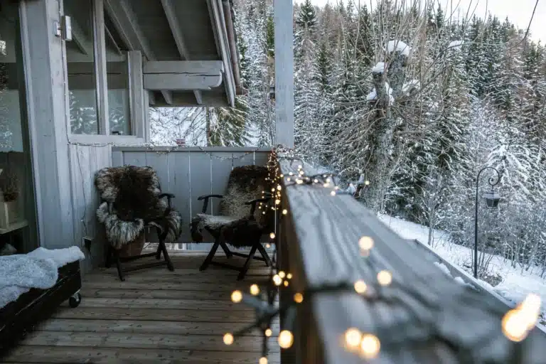 snowy winter balcony with lights